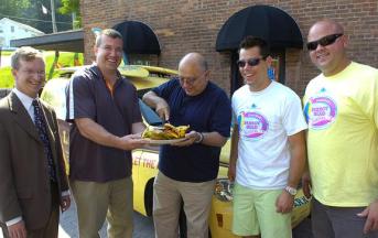 cheeseburger_cutting_343x216 Town of Milton Supervisor Dan Lewza helps steady the plate as Ballston Spa Mayor John Romano cuts the ceremonial cheeseburger Wednesday to promote this weekend’s Parrot Head Festival at the Saratoga County Fairgrounds and its accompanying Jimmy Buffet-themed events in the village of Ballston Spa. Saratoga County Chamber of Commerce President Todd Shimkus and festival promoters Garth Ellms and A.J. Bodden looked on at The Factory in Ballston Spa. (ED BURKE/eburke@saratogian.com)
