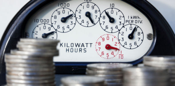 a utility meter in front money saved from energy efficiency programs